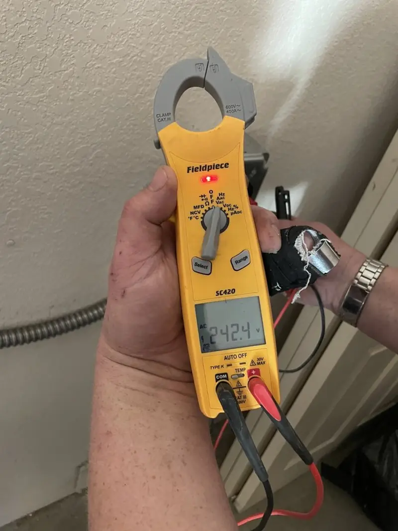 Voltage testing with clamp meter during Ceiling Fan Installation in Hillsdale
